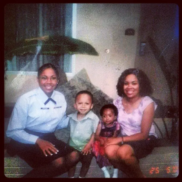 Lisa in Air Force uniform, seated with family
