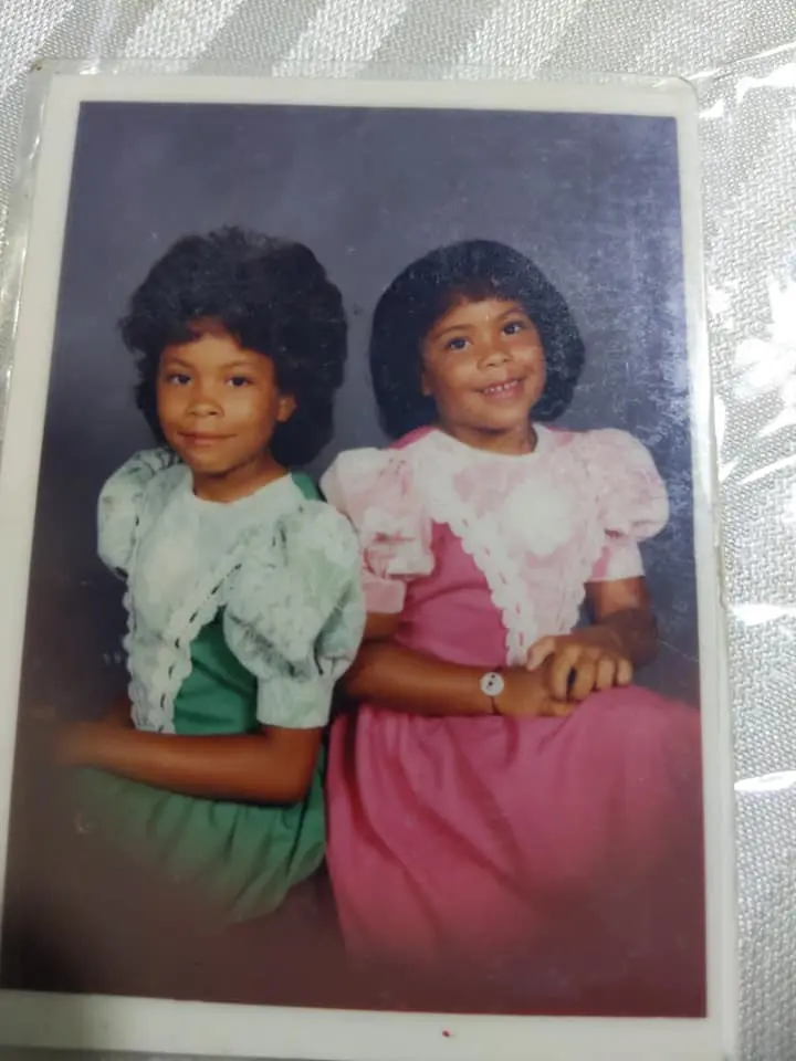 A childhood portrait from Lisa’s family album showing two children