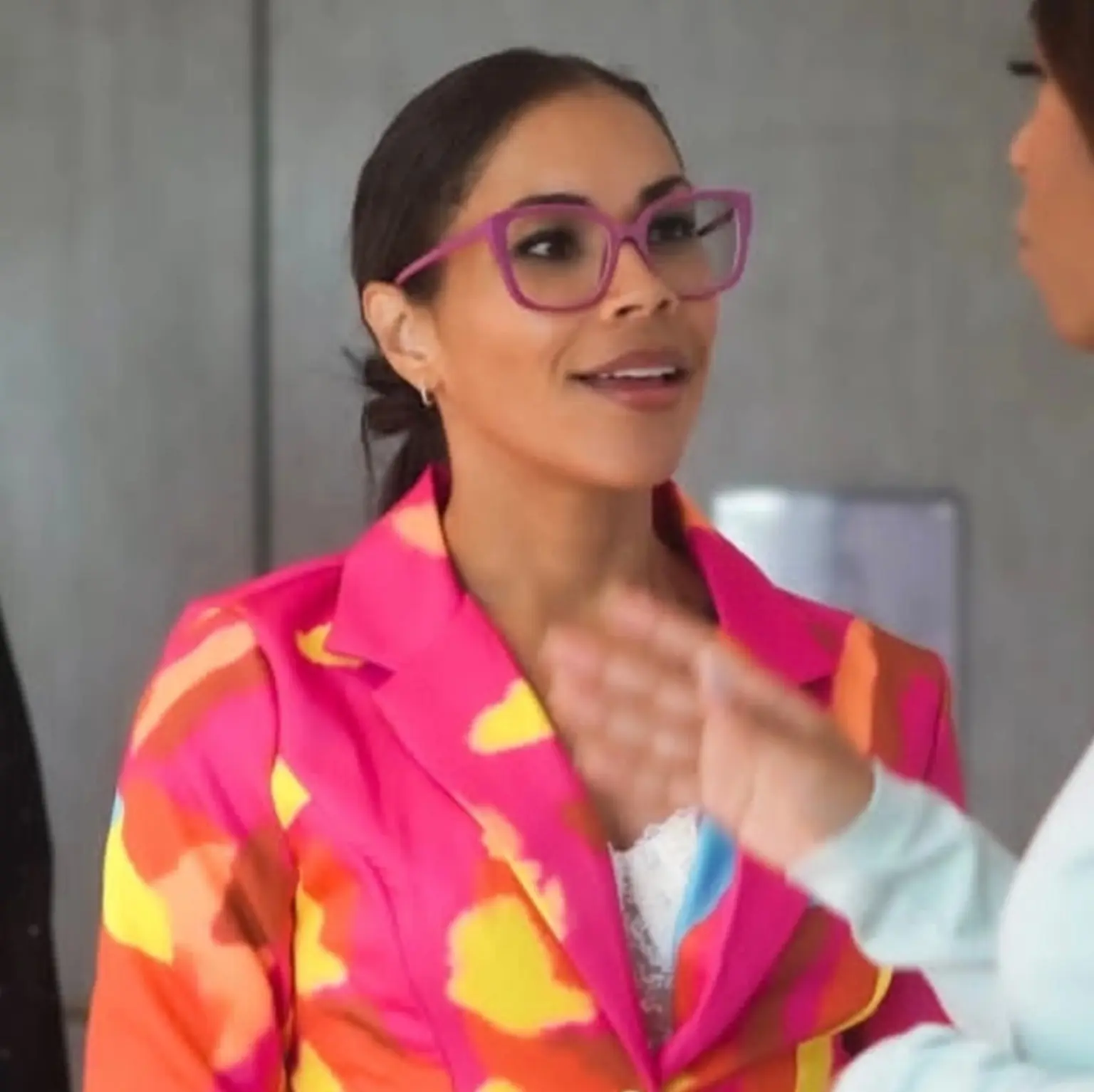 Lisa in conversation with another attendee at an event