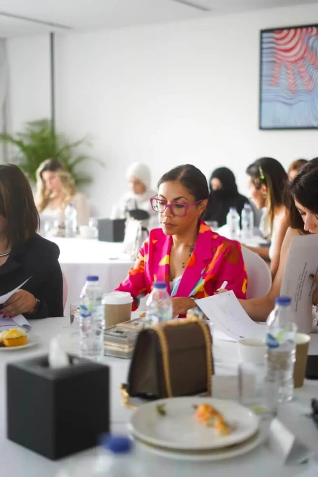 Lisa taking notes as a participant in a workshop